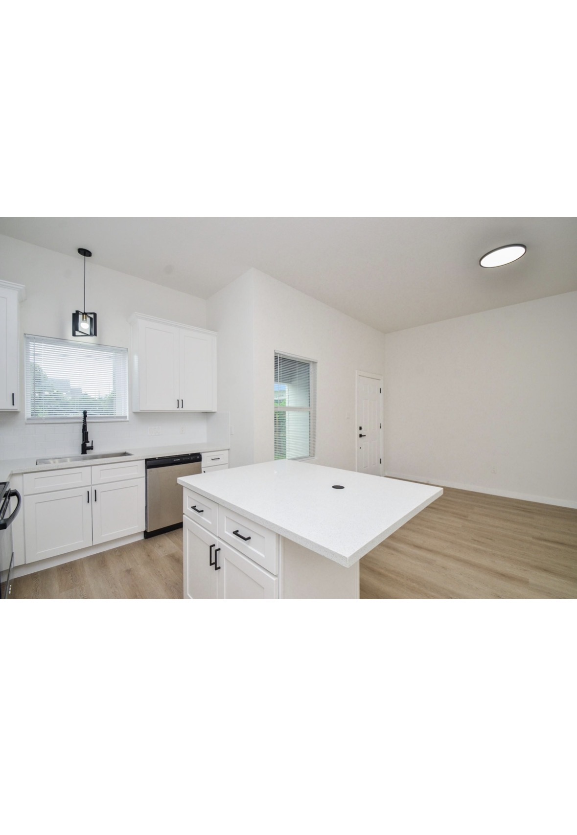 White kitchen island and black hardware
